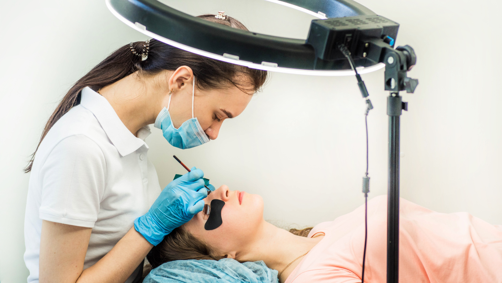 Woman having lashes lifted.